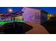 Backyard view with solar panels and pool, showcasing energy efficiency and outdoor amenities, with privacy wall at 528 Lavina Ct, Las Vegas, NV 89123