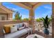 Spacious outdoor balcony with comfortable seating, bar cart, and views of the surrounding neighborhood at 5855 Valley Dr # 2130, North Las Vegas, NV 89031