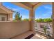 Covered balcony with stucco walls and ornamental plants offers a peaceful outdoor space at 5855 Valley Dr # 2130, North Las Vegas, NV 89031