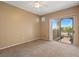 Bright bedroom with sliding glass doors that lead to a private balcony with a view at 5855 Valley Dr # 2130, North Las Vegas, NV 89031