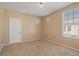 Neutral bedroom with carpet and a large window provides ample natural light at 5855 Valley Dr # 2130, North Las Vegas, NV 89031
