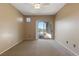 Spacious bedroom with neutral walls, carpet, ceiling fan, and sliding glass doors leading to outdoor deck at 5855 Valley Dr # 2130, North Las Vegas, NV 89031