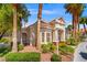 Well-maintained condo with landscaping, mature trees, and manicured hedges at 5855 Valley Dr # 2130, North Las Vegas, NV 89031