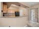 Well lit kitchen with modern appliances, and featuring wooden cabinetry at 5855 Valley Dr # 2130, North Las Vegas, NV 89031