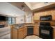 Spacious kitchen with stainless steel appliances and breakfast bar overlooking the living area at 5855 Valley Dr # 2130, North Las Vegas, NV 89031