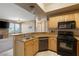 View of the kitchen and living room area. Open concept design with breakfast bar at 5855 Valley Dr # 2130, North Las Vegas, NV 89031