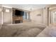 Large living room with a stone fireplace and a door that leads outside at 5855 Valley Dr # 2130, North Las Vegas, NV 89031