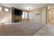 Spacious carpeted living room with natural light and a fireplace with mounted television at 5855 Valley Dr # 2130, North Las Vegas, NV 89031