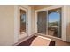 Outdoor patio featuring desert view, a sliding glass door, and access door at 5855 Valley Dr # 2130, North Las Vegas, NV 89031