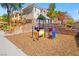 Colorful playground with play structure, wood chips and shade at 5855 Valley Dr # 2130, North Las Vegas, NV 89031