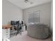 This bedroom is roomy with a modern desk, chair, and beanbag, perfect for working or relaxing at 5953 Yellow Ridge Ave, Las Vegas, NV 89131