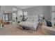 Serene main bedroom boasts neutral colors, a large mirror, and a sitting area at 5953 Yellow Ridge Ave, Las Vegas, NV 89131