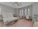 Comfortable main bedroom with neutral colors, a sitting area, and lots of natural light at 5953 Yellow Ridge Ave, Las Vegas, NV 89131