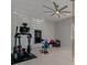 Exercise room with ceiling fan, light wood floors, and an array of workout equipment at 5953 Yellow Ridge Ave, Las Vegas, NV 89131