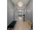 Elegant hallway featuring hardwood floors, decorative lighting, and neutral walls at 5953 Yellow Ridge Ave, Las Vegas, NV 89131