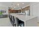 Modern kitchen with an expansive island, stainless steel appliances, and counter seating at 5953 Yellow Ridge Ave, Las Vegas, NV 89131