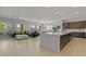 Spacious open-concept kitchen and living area with a large island and modern appliances at 5953 Yellow Ridge Ave, Las Vegas, NV 89131