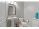 Powder room with pedestal sink, toilet, and decorative accents at 5953 Yellow Ridge Ave, Las Vegas, NV 89131