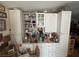 Built-in white cabinetry and a countertop adorned with dishes and various decorative items at 6271 Explorer Dr, Las Vegas, NV 89103
