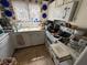 Kitchen with a white oven and cabinetry, filled with cookware and appliances at 6271 Explorer Dr, Las Vegas, NV 89103