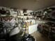 Laundry room with shelving, appliances, and cluttered items at 6271 Explorer Dr, Las Vegas, NV 89103