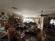 Spacious living room with various furniture, decor, and personal belongings throughout the space at 6271 Explorer Dr, Las Vegas, NV 89103