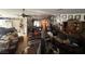 Spacious living room with various furniture, decor, and personal belongings throughout the space at 6271 Explorer Dr, Las Vegas, NV 89103