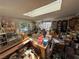 Sunroom featuring bookshelves, a skylight and an array of personal belongings at 6271 Explorer Dr, Las Vegas, NV 89103