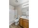 Bathroom featuring a shower/tub combo, vanity with storage, and updated fixtures at 6525 Raven Hall St, North Las Vegas, NV 89084