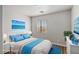 Staged bedroom featuring ample light, neutral tones, and a calming aesthetic at 6525 Raven Hall St, North Las Vegas, NV 89084