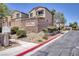 Welcoming Shadow Crossing community entrance with tidy landscaping and well-maintained walkways at 6525 Raven Hall St, North Las Vegas, NV 89084