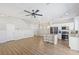 Spacious living area with stainless appliances, white cabinets, breakfast bar, and direct stair access at 6525 Raven Hall St, North Las Vegas, NV 89084