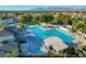 Aerial view of community pool including a hot tub and a recreation area for sunny days at 6652 Coral Springs Cir, Las Vegas, NV 89108