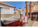 Cozy backyard with a hot tub for relaxing with towels and desert landscaping at 6652 Coral Springs Cir, Las Vegas, NV 89108