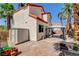 Backyard featuring a covered patio, storage shed, and lush palm trees, perfect for outdoor enjoyment at 6652 Coral Springs Cir, Las Vegas, NV 89108