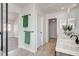 Bright bathroom featuring dual sinks, tile floors, and an open doorway to a closet at 6652 Coral Springs Cir, Las Vegas, NV 89108