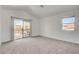 Light-filled bedroom with sliding glass door to the balcony at 6652 Coral Springs Cir, Las Vegas, NV 89108