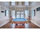 Charming game room with a pool table, hardwood floors, and ample natural light at 6652 Coral Springs Cir, Las Vegas, NV 89108