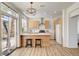 Open kitchen design boasts an island, stainless appliances, and easy access to the outdoor space at 6652 Coral Springs Cir, Las Vegas, NV 89108
