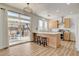 Bright eat-in kitchen featuring an island with bar seating and sliding glass doors to the backyard patio at 6652 Coral Springs Cir, Las Vegas, NV 89108