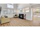 Spacious living room with a fireplace, high ceilings, and large windows offering ample natural light at 6652 Coral Springs Cir, Las Vegas, NV 89108