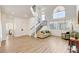 Open-concept living area with staircase, fireplace, and contemporary design at 6652 Coral Springs Cir, Las Vegas, NV 89108