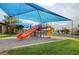 Bright and fun community playground with slides, climbing structures, and shaded areas at 6652 Coral Springs Cir, Las Vegas, NV 89108