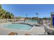 Inviting community pool with tables and seating areas perfect for relaxation and socializing at 6652 Coral Springs Cir, Las Vegas, NV 89108