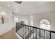 Carpeted staircase with black wrought-iron railing at 6652 Coral Springs Cir, Las Vegas, NV 89108