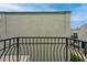 Balcony view with black iron railing and views of the complex at 7066 Burcot Ave # 59, Las Vegas, NV 89156