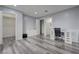 Neutral bedroom boasts wood-look floors, and multiple doorways to closet and bath at 7066 Burcot Ave # 59, Las Vegas, NV 89156