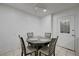 Cozy dining room with seating for four and a bright, airy atmosphere at 7066 Burcot Ave # 59, Las Vegas, NV 89156