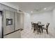 The kitchen and dining area features stainless appliances, gray cabinets, and bright light at 7066 Burcot Ave # 59, Las Vegas, NV 89156
