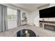 Inviting living room with a stylish console table and a modern TV at 7066 Burcot Ave # 59, Las Vegas, NV 89156